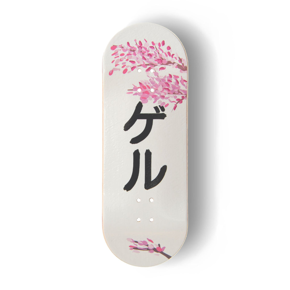 A Yurt fingerboard deck consisting of a 5-ply maple deck with a colourful Real Wear graphic design featuring pink cherry blossom illustrations on a white background and the black Japanese katakana characters 'ゲル' meaning Geru or Yurt, printed vertically in the centre. 