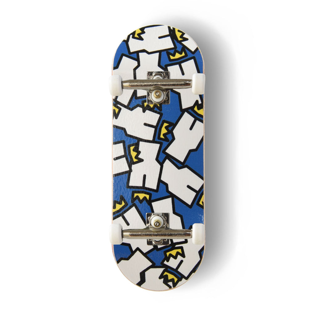 A Yurt fingerboard complete with silver trucks and white wheels, consisting of a 5-ply maple deck with a colourful Real Wear graphic design of the Yurt Crowns logo on a Blue background. 