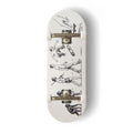 A Yurt fingerboard complete with silver trucks and white wheels, consisting of a 5-ply maple deck with a Real Wear graphic design featuring black anatomical sketches of the evolution of man with ape to human figures in various poses.