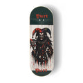 A Yurt fingerboard  deck consisting of a 5-ply maple deck with a colourful Real Wear graphic design featuring a dark, horror-themed jester graphic on a white background, with dark green ends and the word 'Yurt' printed in red gothic lettering.