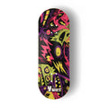 A Yurt fingerboard  deck consisting of a 5-ply maple deck with a colourful Real Wear graphic design with a cohort of pink, green, yellow and purple monsters on a black background. 
